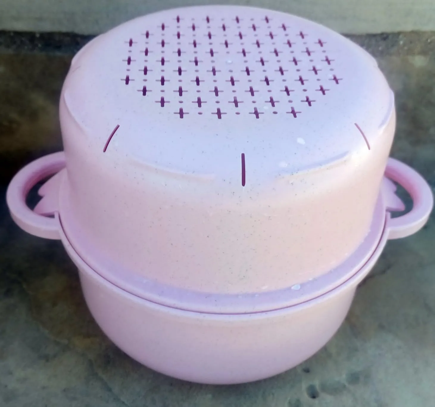 It's a cute well-designed pig-shaped set with stacking bowls where every cute part is functional